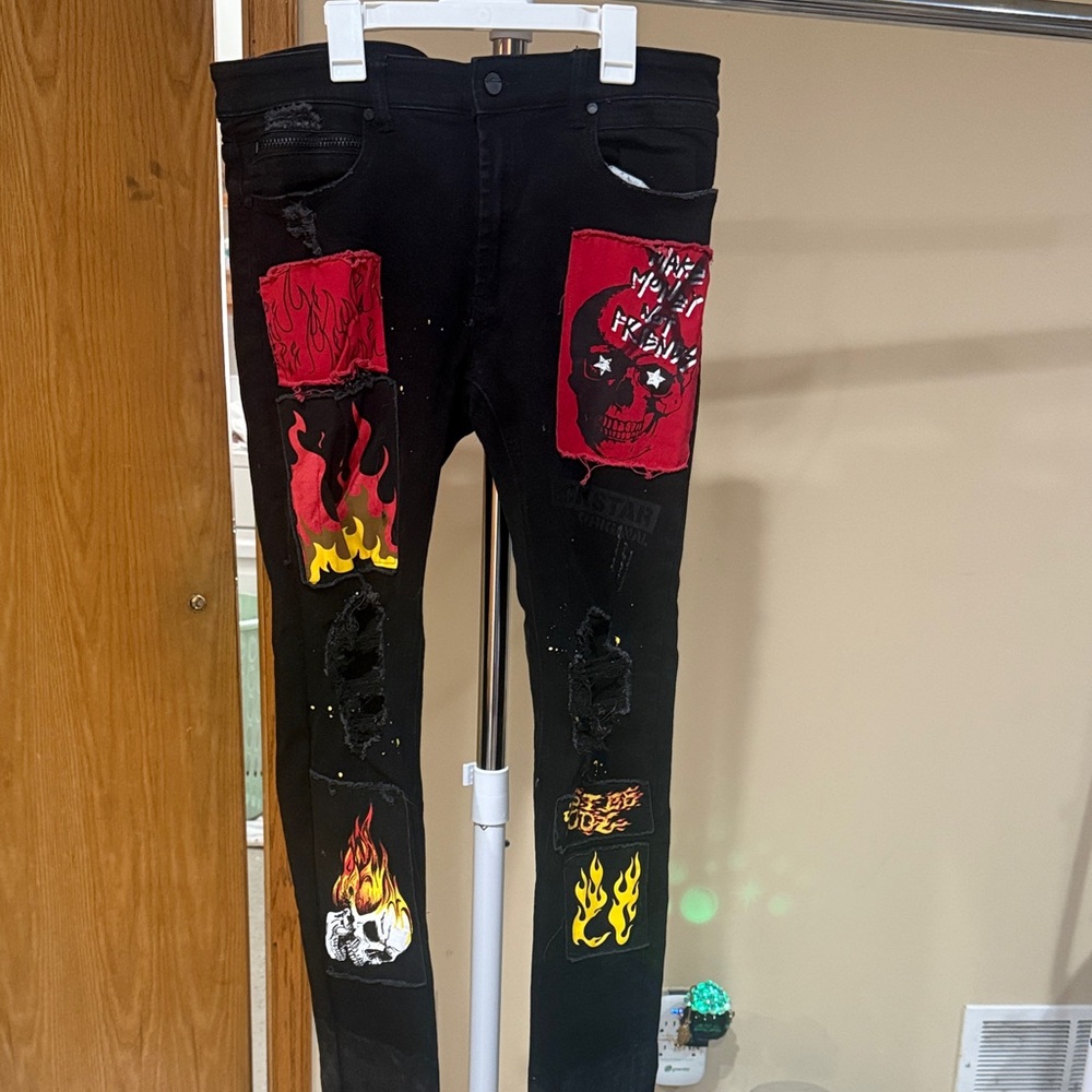 Black Distressed Jeans with Red and Yellow Graphic Patches